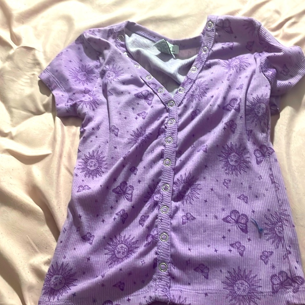 Purple tight shirt.